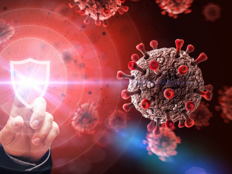Coronavirus-Zellen mit einem Schutz.